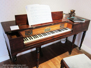 A pianoforte from Jane Austen's House Museum in Chawton. The plate reads: "Square piano 1810. Piano made by Clementi in London. This may be similar to the piano that Jane bought after arriving here."